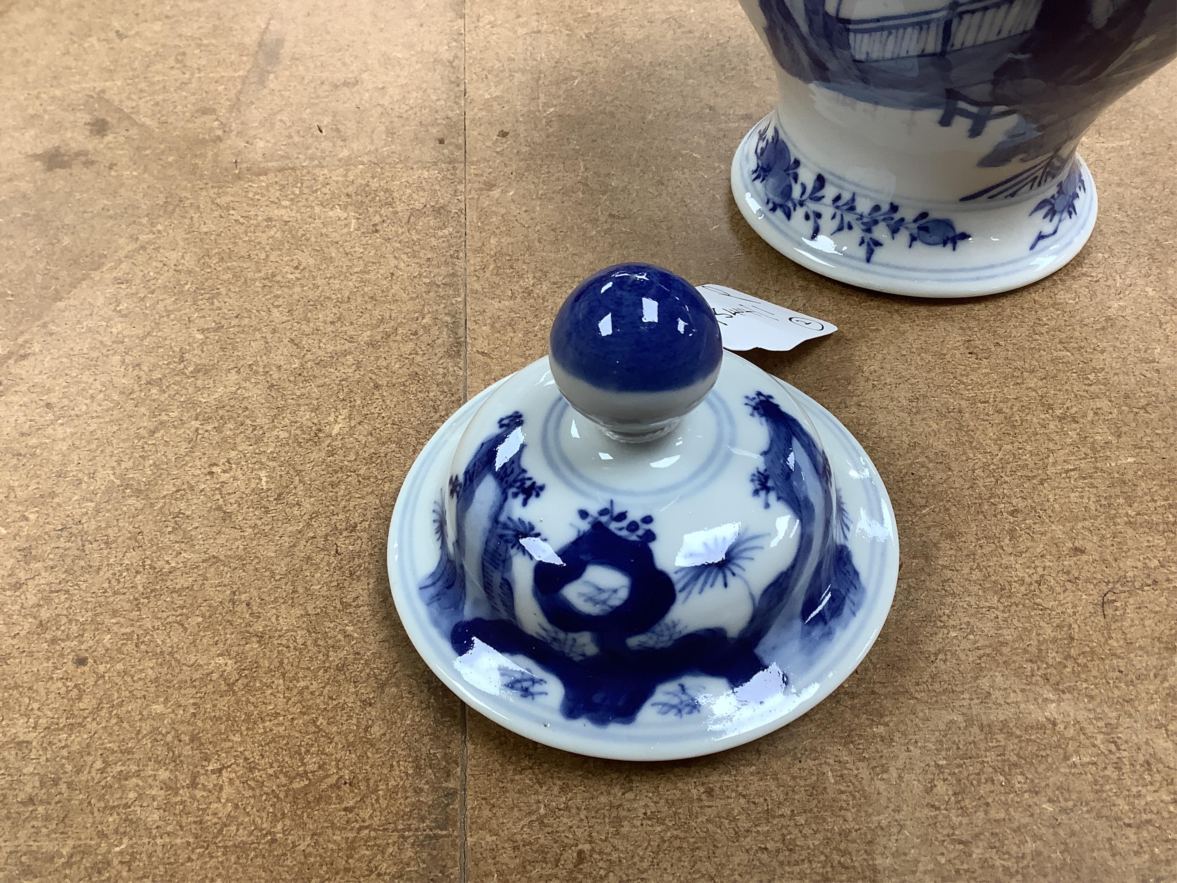 An early 20th century Chinese blue and white porcelain vase and cover decorated with figures in a landscape and a Japanese circular bowl, tallest 23cm. Condition - good